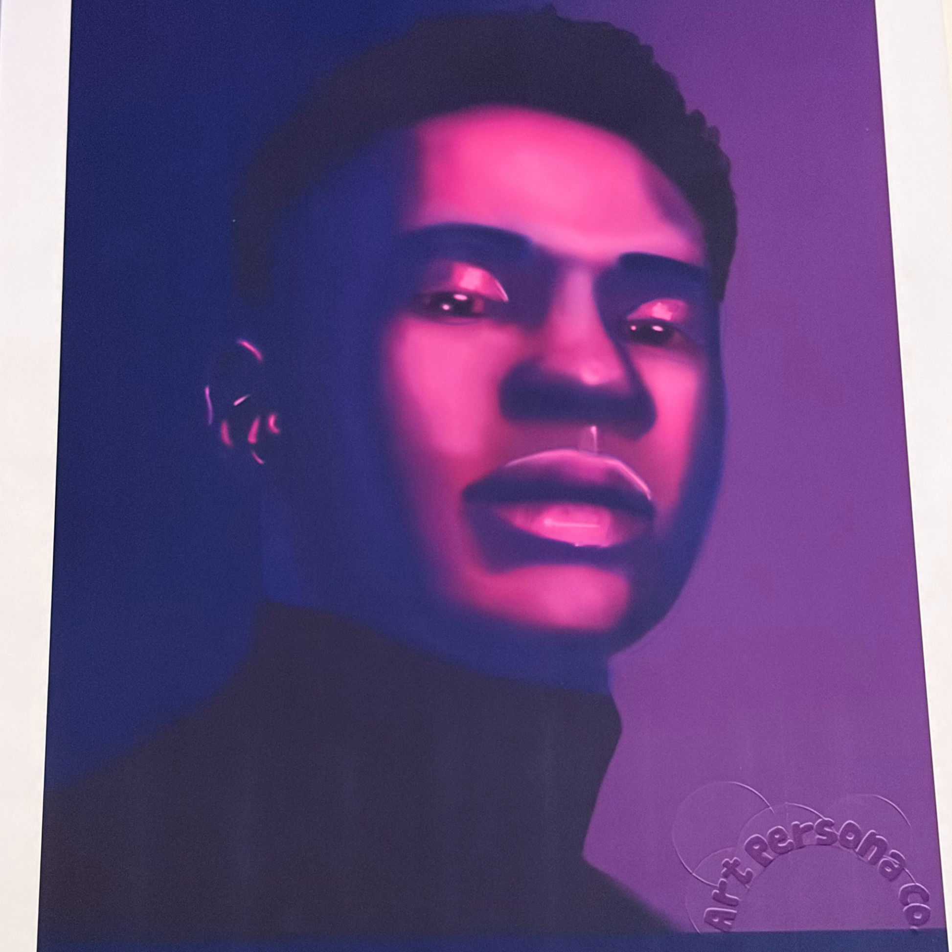 A man in purple lighting. Highlighting the value of presence with his focus.